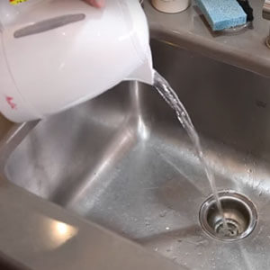 how to unclog a double kitchen sink with standing water